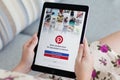 Woman holding iPad Pro Space Gray with social Internet Pinterest