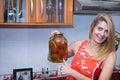 Woman holding a jar with pickels Royalty Free Stock Photo