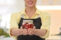 Woman holding jar of pickled vegetables in kitchen Royalty Free Stock Photo