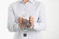 Woman is holding jar of piggy bank with coins with hands tied