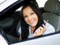 Woman holding key to the car