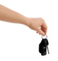 Woman holding key on white background. Car buying Royalty Free Stock Photo