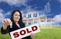 Woman Holding Keys, Sold Sign with Ghosted House Drawing Behind Royalty Free Stock Photo