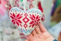 Woman holding knitted heart. Gift choice for St Valentine`s day Royalty Free Stock Photo
