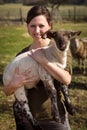 Woman holding a lamb, vegan and vegetarian life