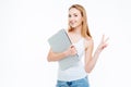 Woman holding laptop computer and showing two fingers sign Royalty Free Stock Photo