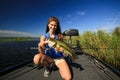 Woman Holding Large Mouth Bass Caught Fishing From Boat Royalty Free Stock Photo