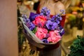 Woman holding a large purple and pink flower bouquet for the Valentine s day Royalty Free Stock Photo