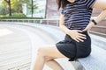 Woman holding the left side of her waist in pain,painful in the flank between ribs and hip,symptoms of kidney infection,acute Royalty Free Stock Photo