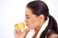 Woman holding lemon while making a face Royalty Free Stock Photo