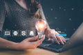 Woman holding light bulb and update software computer. Program upgrade business technology internet on virtual screen. loading bar