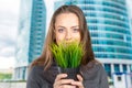 Woman holding a little green plant Royalty Free Stock Photo