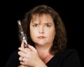 Woman holding loaded gun Royalty Free Stock Photo