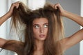 Woman With Holding Long Damaged Dry Hair. Hair Damage, Haircare. Royalty Free Stock Photo
