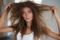 Woman With Holding Long Damaged Dry Hair. Hair Damage, Haircare. Royalty Free Stock Photo