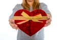 Woman holding a love heart box on white background Royalty Free Stock Photo