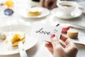 Woman holding love note on small card