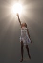 Woman holding luminous sphere