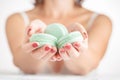 Woman holding macaroons, closeup Royalty Free Stock Photo