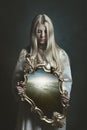 Woman holding magical mirror Royalty Free Stock Photo