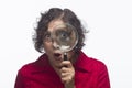 Woman holding magnifying glass up to her eye, horizontal Royalty Free Stock Photo