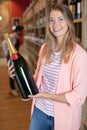 woman holding magnum champagne