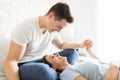 Woman Holding Man`s Hand While Lying On His Legs Royalty Free Stock Photo