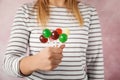 Woman holding many colorful lollipop candies on color background Royalty Free Stock Photo