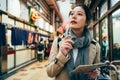 Woman holding map guidebook searching for place