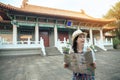 Woman holding a map and visiting old temple Royalty Free Stock Photo