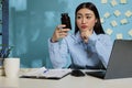 Woman holding medication container at office Royalty Free Stock Photo