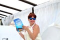 woman holding the menu in chiringuito beach restaurant Jimmy Beach in Torremolinos, Costa del Sol, Spain Royalty Free Stock Photo