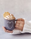 Woman holding metal mug of hot chocolate in hands Royalty Free Stock Photo