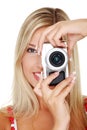 Woman holding a micro four thirds photo camera.