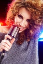 Woman holding microphone Royalty Free Stock Photo