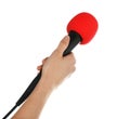 Woman holding microphone on white background Royalty Free Stock Photo