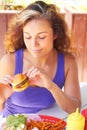 Woman Holding a Mini Burger Royalty Free Stock Photo