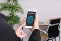 Woman holding mobile phone with blank screen in office, closeup Royalty Free Stock Photo