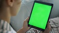 Woman holding mockup tablet computer at home closeup. Student watching online Royalty Free Stock Photo