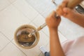 Woman holding a mop spinning in the bucket to cleaning and mopping the floor in the living room. Woman doing chores at home. Royalty Free Stock Photo