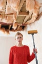 Woman Holding Mop Under Damaged Ceiling Royalty Free Stock Photo