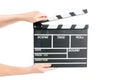 Woman holding movie production clapper board