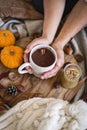 Woman holding mug of hot chocolate with both hands Royalty Free Stock Photo