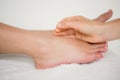 Woman holding a needle in an acupuncture therapy Royalty Free Stock Photo