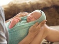 Woman holding a newborn baby on her legs Royalty Free Stock Photo