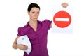 Woman holding a no entry sign Royalty Free Stock Photo