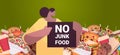 woman holding no junk food placard unhealthy nutrition junkfood addiction stop fast food concept