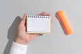 Businesswoman Holding Notepad With Important Message On Office Desk With Marker. Woman Presenting Crutial Information On Royalty Free Stock Photo