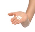 Woman holding on open palm painkiller pill tablets medicine Royalty Free Stock Photo