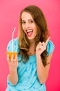 Woman holding orange with straw Royalty Free Stock Photo